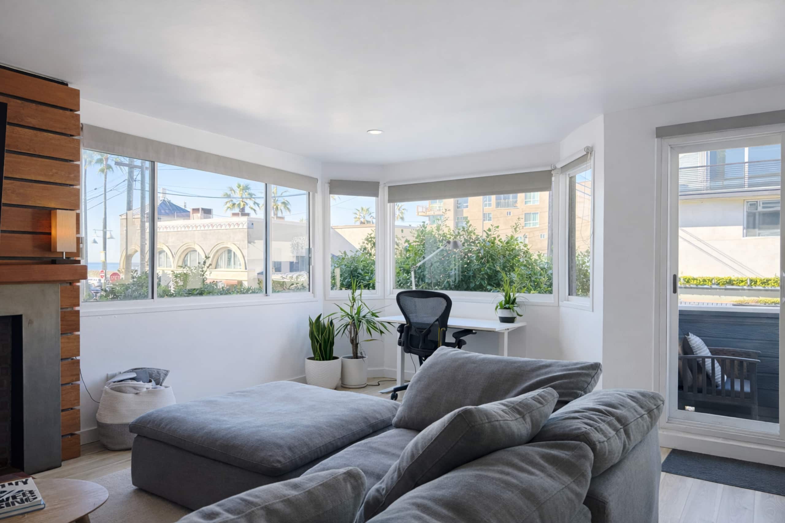 Living room with corner windows and plants